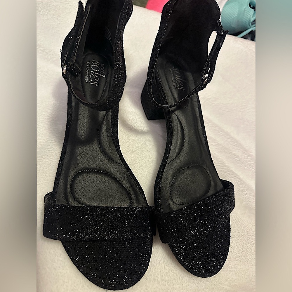 Black dress shoes with buckle around ankle